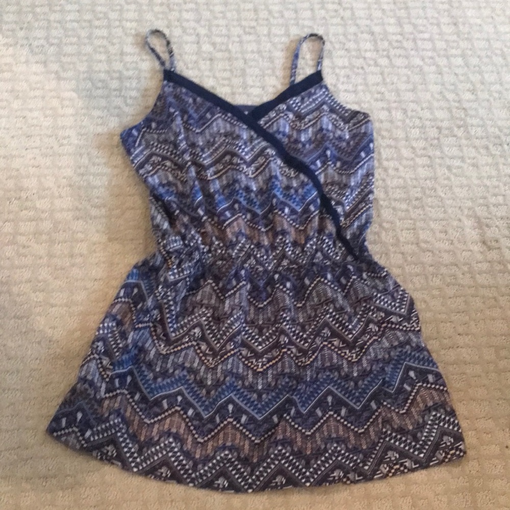 Cute romper with over skirt.